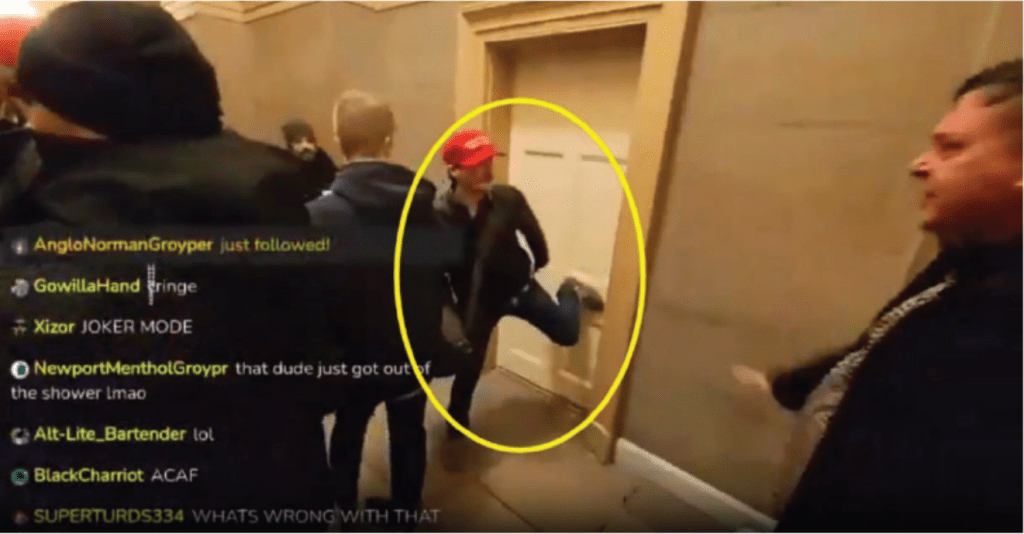 A man in a red cap kicks sideways into a door